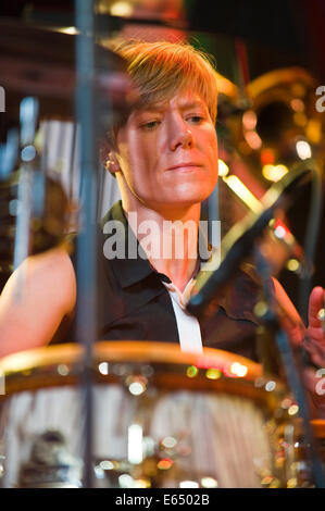 Live music female percussionist with Loose Tubes 21-piece big band on stage at Brecon Jazz Festival 2014 Stock Photo