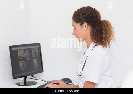 Dental assistant working on computer Stock Photo