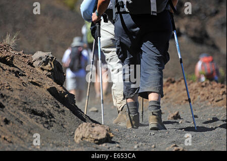 People walking and hiking on volcano trail in the Haleakala crater, Maui Island, Hawaii Islands, USA Stock Photo