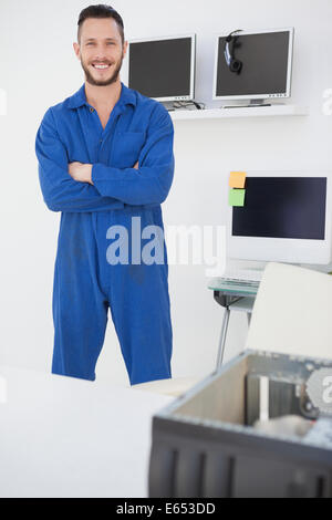 Computer engineer standing and smiling at camera Stock Photo