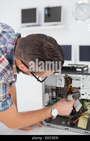 Computer engineer working on broken console Stock Photo