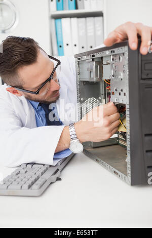 Computer engineer working on broken console Stock Photo