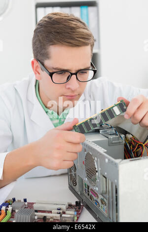 Technician working on broken cpu Stock Photo