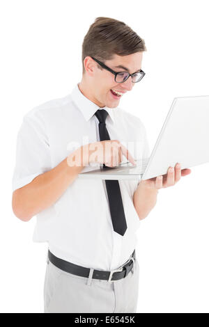 Nerdy businessman holding his laptop Stock Photo