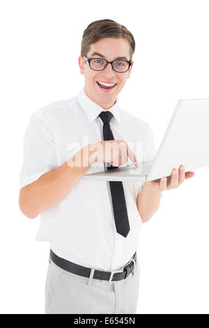 Nerdy businessman holding his laptop Stock Photo