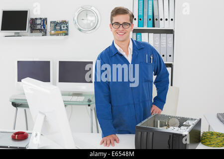 Smiling technician looking at camera Stock Photo