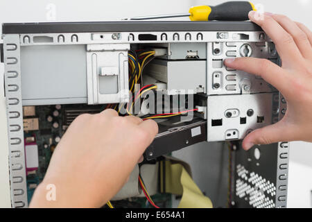 Technician working on broken computer Stock Photo