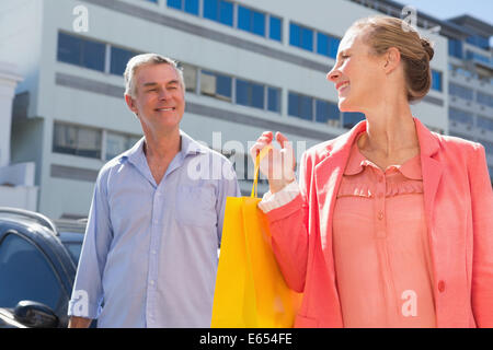 Happy senior couple shopping in the city Stock Photo