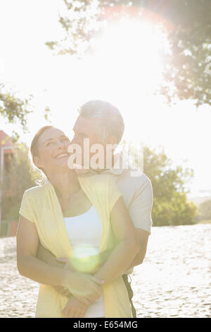 Happy senior couple embracing in the city Stock Photo