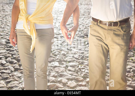 Happy senior couple touching hands Stock Photo