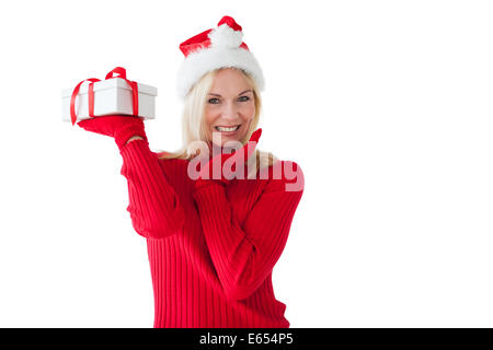 Festive blonde holding a present Stock Photo