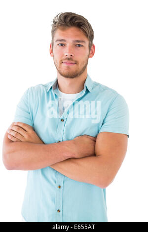 Handsome young man posing with arms crossed Stock Photo