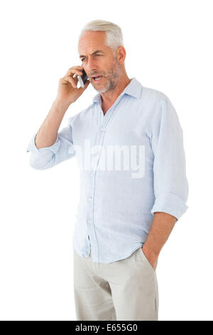 Serious man talking on the phone Stock Photo