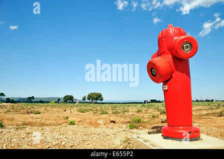 Red fire hydrant in remote countryside, Var, France, Europe Stock Photo