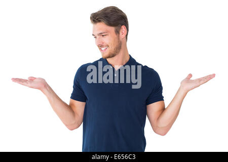 Handsome young man holding his hands out Stock Photo