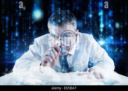 Composite image of mature businessman examining with magnifying glass Stock Photo