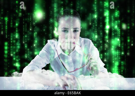 Composite image of businesswoman typing on a keyboard Stock Photo