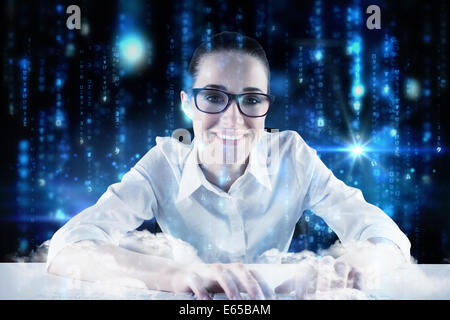 Composite image of businesswoman typing on a keyboard Stock Photo