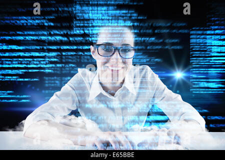 Composite image of businesswoman typing on a keyboard Stock Photo