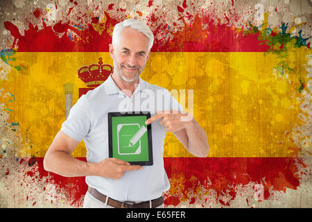 Composite image of mature student showing tablet pc Stock Photo