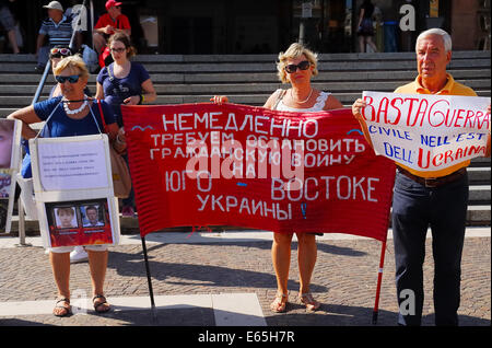 Venice, Italy. 14th Aug, 2014. Ukrainian women protest in front of  the railway station against military intervention of the Ukrainian Government in Donbass. A group of Ukrainian women who work in Italy organize a sit-in in front of Venice railway station to denounce war crimes against Russian people. Credit:  Ferdinando Piezzi/Alamy Live News Stock Photo