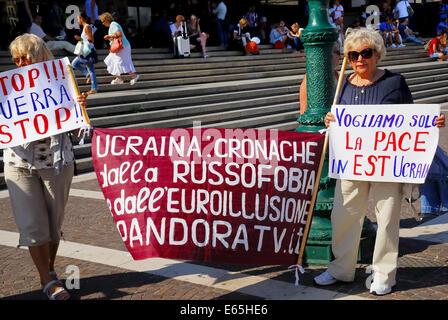 Venice, Italy. 14th Aug, 2014. Ukrainian women protest in front of  the railway station against military intervention of the Ukrainian Government in Donbass. A group of Ukrainian women who work in Italy organize a sit-in in front of Venice railway station to denounce war crimes against Russian people. Credit:  Ferdinando Piezzi/Alamy Live News Stock Photo