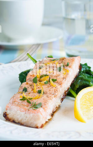 Grilled salmon with spinach, lemon and thyme Stock Photo