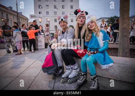 Warsaw, Poland. 14th August, 2014. People takes part in Nightskating Warsaw -  mass skate event on city streets, starts by the Copernicus Monument on Krakowskie Przedmiescie street in Warsaw, Poland Credit:  kpzfoto/Alamy Live News Stock Photo
