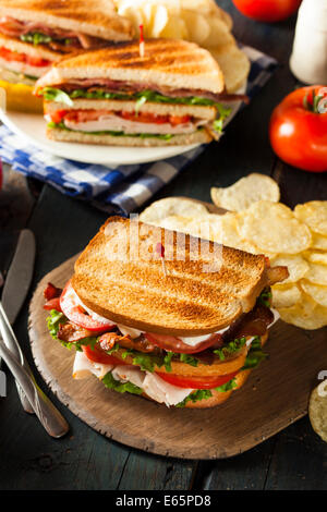 Turkey and Bacon Club Sandwich with Lettuce and Tomato Stock Photo