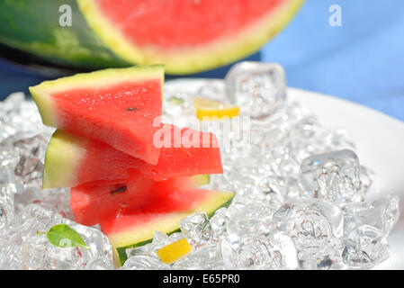 slices of red watermelon and ice cubes Stock Photo