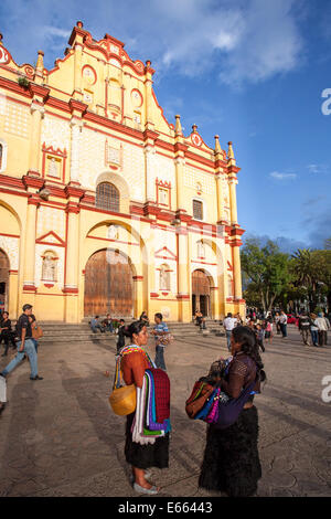 Two vendors chat in front of the cathedral in San Cristobal de las Casas, Chiapas, Mexico. Stock Photo