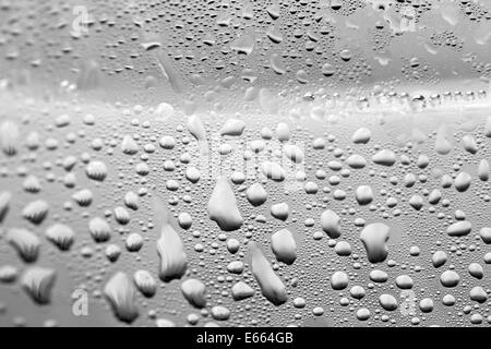 Water drops on gray bottle background Stock Photo