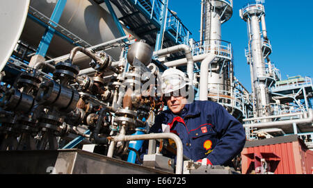 oil and gas worker inside refinery Stock Photo