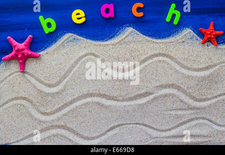 The word beach laid on the sand Stock Photo