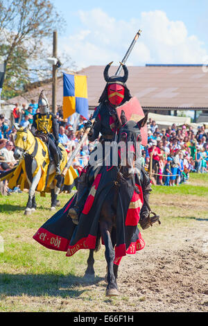 HINWIL, SWITZERLAND - MAY 18: Unidentified man in knight armor on the horse ready for action during tournament reconstruction ne Stock Photo