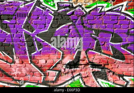 Brick wall with graffiti close-up, may be used as background Stock Photo