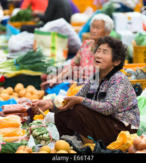 Market vendors in Busan vegetable market, South Korea. Stock Photo