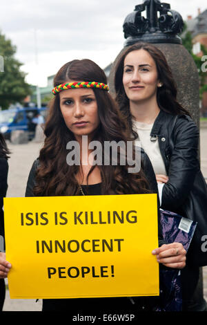 Copenhagen, Denmark – August 16th, 2014: Two young Kurdish women partcipating in the Kurdish solidarity demonstration in front of the Danish parliament in Copenhagen against ISIS (Islamic State) warfare and atrocities in Iraq. Credit:  OJPHOTOS/Alamy Live News Stock Photo