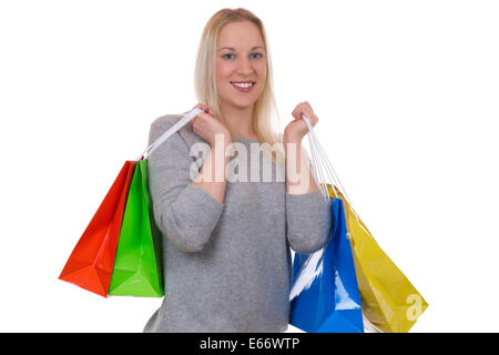 Blond woman with shopping bags, isolated on a white background Stock Photo