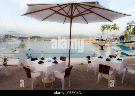 Tables line the marina at the Las Hadas Resort in Manzanillo, Colima. Stock Photo