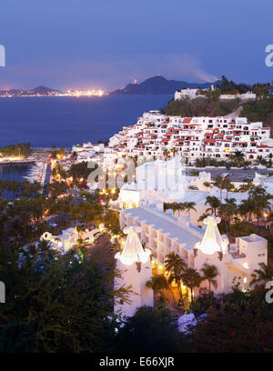 Las Hadas Resort at Twilight with Santiago Bay and the Town of Manzanillo, Colima, Mexico in the background. Stock Photo