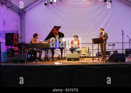 Worms, Germany. 16th August 2014. The Louis Sclavis Atlas Trio (from left to right Benjamin Moussay, Gilles Coronado and Louis Sclavis) is pictured performing live on stage at the Jazz and Joy festival 2014 in Worms. The Louis Sclavis Atlas Trio performed live at the Jazz and Joy Festival 2014 in Worms. The founder Louis Sclavis has won the Prix Django Reinhardt award and the British Jazz-Award. Credit:  Michael Debets/Alamy Live News Stock Photo