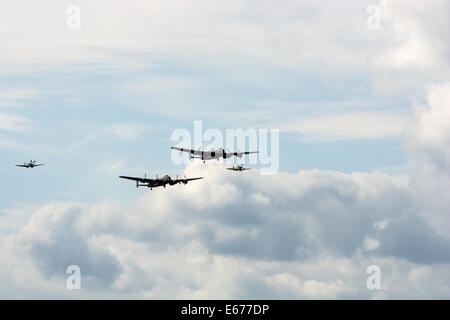 Two Lancaster bombers and fighter escort Stock Photo