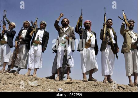 Sanaa, Yemen. 17th Aug, 2014. Armed Yemeni tribesmen rallied to show their support to the Yemeni army in the fighting against al-Qaida militants, north of Sanaa, Yemen, on Aug. 17, 2014. Conflicts between the Yemeni army and the al-Qaida in the Arabian Peninsula (AQAP) broke out earlier this month in the country's southern province of Hadramout, causing dozens of people killed. Credit:  Mohammed Mohammed/Xinhua/Alamy Live News Stock Photo