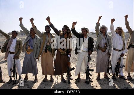 Sanaa, Yemen. 17th Aug, 2014. Armed Yemeni tribesmen rallied to show their support to the Yemeni army in the fighting against al-Qaida militants, north of Sanaa, Yemen, on Aug. 17, 2014. Conflicts between the Yemeni army and the al-Qaida in the Arabian Peninsula (AQAP) broke out earlier this month in the country's southern province of Hadramout, causing dozens of people killed. Credit:  Mohammed Mohammed/Xinhua/Alamy Live News Stock Photo