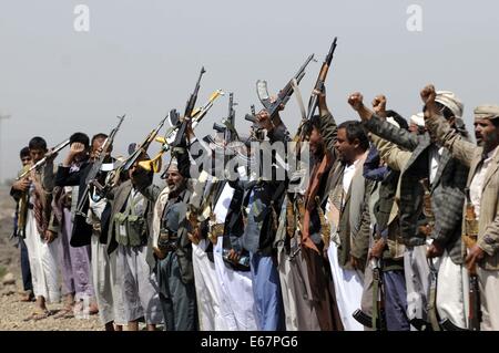 Sanaa, Yemen. 17th Aug, 2014. Armed Yemeni tribesmen rallied to show their support to the Yemeni army in the fighting against al-Qaida militants, north of Sanaa, Yemen, on Aug. 17, 2014. Conflicts between the Yemeni army and the al-Qaida in the Arabian Peninsula (AQAP) broke out earlier this month in the country's southern province of Hadramout, causing dozens of people killed. Credit:  Mohammed Mohammed/Xinhua/Alamy Live News Stock Photo