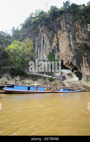 Tourist boats at Pak Ou Buddha Cave, Luang Prabang, Laos. Stock Photo