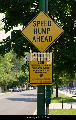 Speed hump ahead and safe school zone warning sign, Chicago, Illinois. Stock Photo