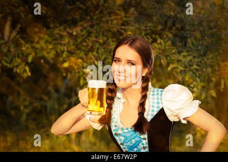 Young Bavarian Woman Holding Beer Tankard Stock Photo