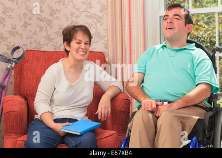 Couple with Cerebral Palsy smiling at home Stock Photo